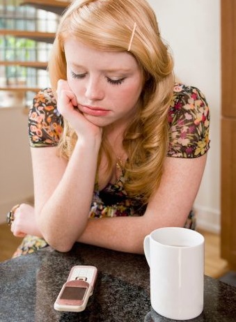 Girl Waiting by Phone